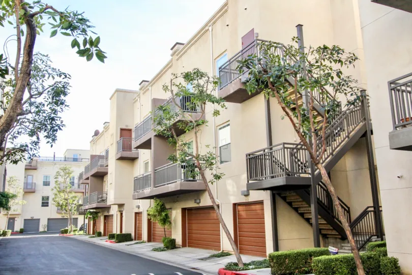 Two stories of balconies above garages at Soco Walk Fullerton CA
