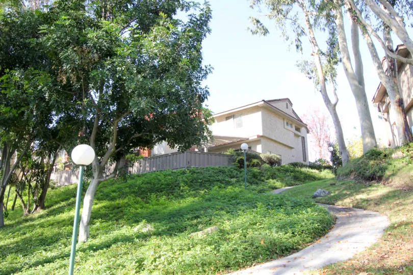 The sunny day in the Sunny Ridge Townhomes with villas and gardens