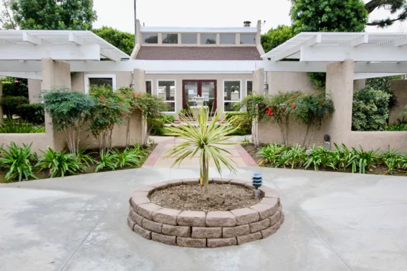 The Arbor Fullerton California grant look with broad roof and rare plants stick to its walls