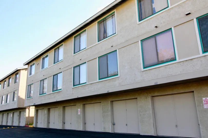 Multi level building with storage doors on the first floor located in the community The Crossing.