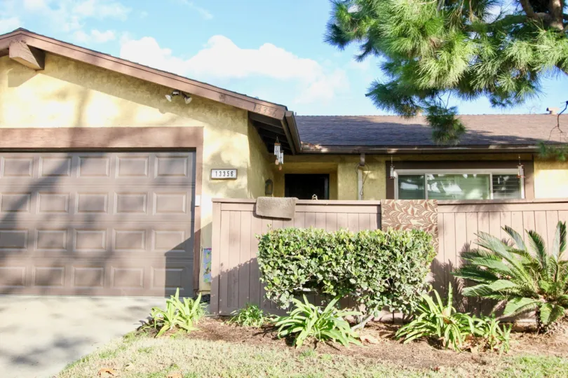 A single-story home with a fenced-in front yard located in the Beach Terrace neighborhood of Garden Grove, California.