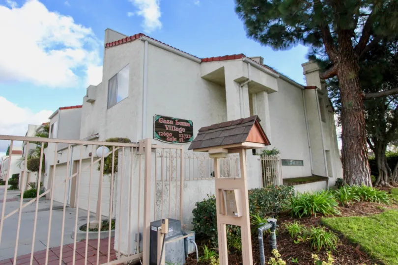 THE 23690-12722 APARTMENTS IN THE CASA LOMA VILLAGE WITH THE PLANTS, GATE, TREES