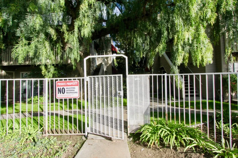 compound gate have private property board near trees and plants around in Cobblestone Creek