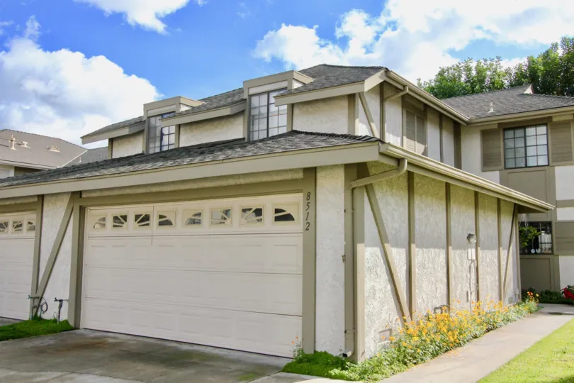 THE 8512 APARTMENT IN THE DEVONSHIRE VILLAGE WITH THE SHUTTER, LAWN, PLANTS, TREES