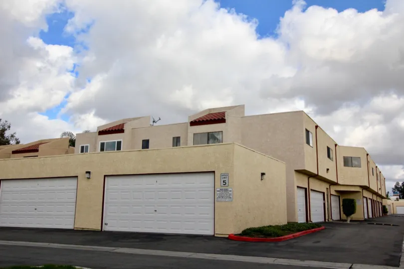 A two-story apartment complex with exterior garages at Garden Creek, in Garden Grove, California.
