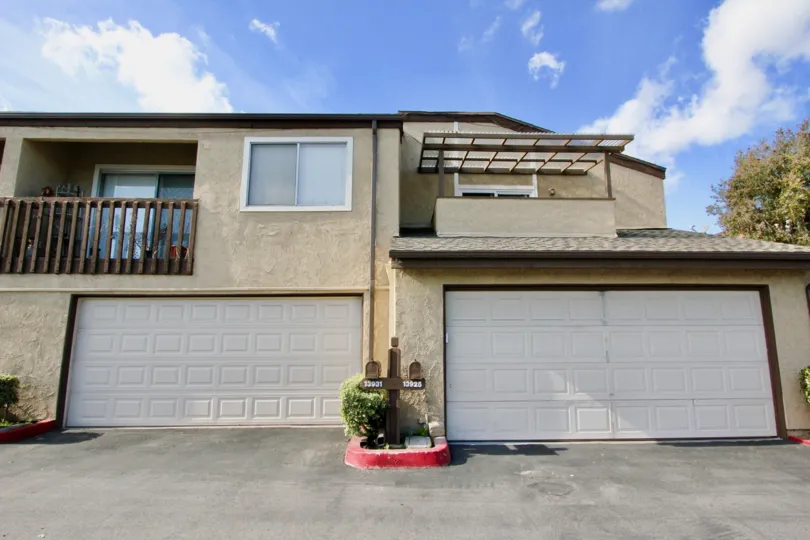THIS IMAGE VIEWS THE HOME WITH THE SHED WHICH IS LOCATED IN THE CITY OF GARDEN GROVE, THAT HAS THE PLANTS, AND THE NUMBER BOARDS