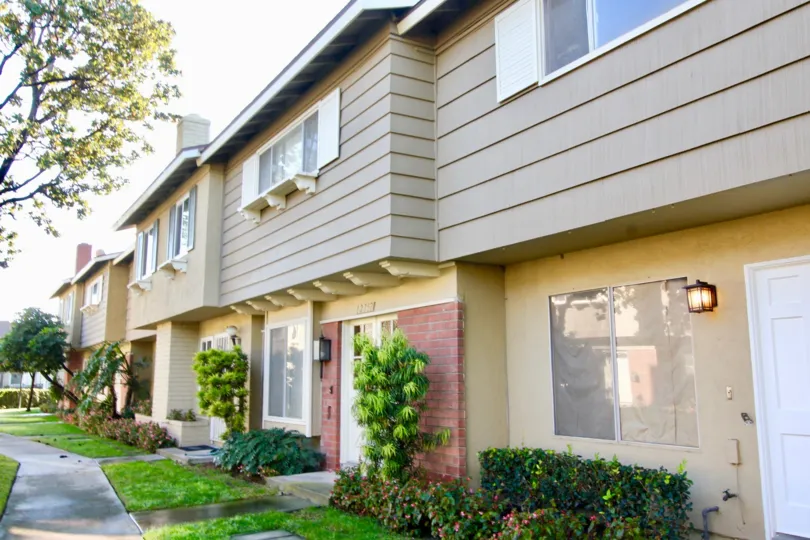 A narrow path way in front of row houses inside Garden Valley community