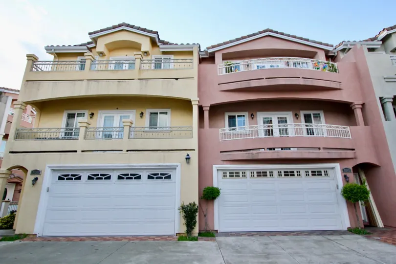 THIS IMAGE SHOWS FRONT THE TWO VILLAS WHICH HAS THE PLANTS, GLASS WINDOWS, AND THE SHED IS IN THE CITY OF GARDEN GROVE