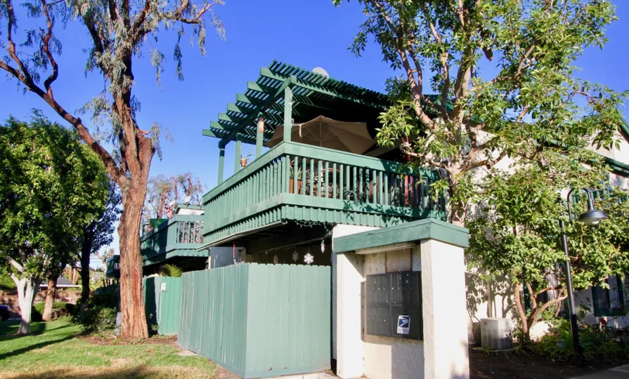 The Greenhouse West in the Garden Grove with Houses and trees