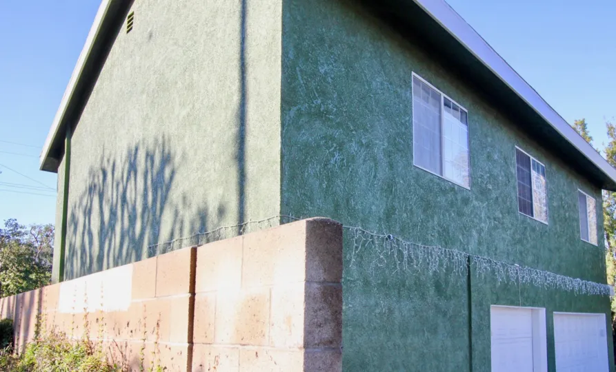 Two Story Building with Garage Doors and windows at Greenhouse West in Garden Grove, CA