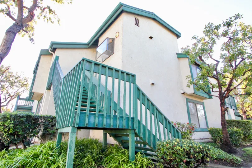 The Greenhouse West in the Garden Grove with a beautiful House and trees
