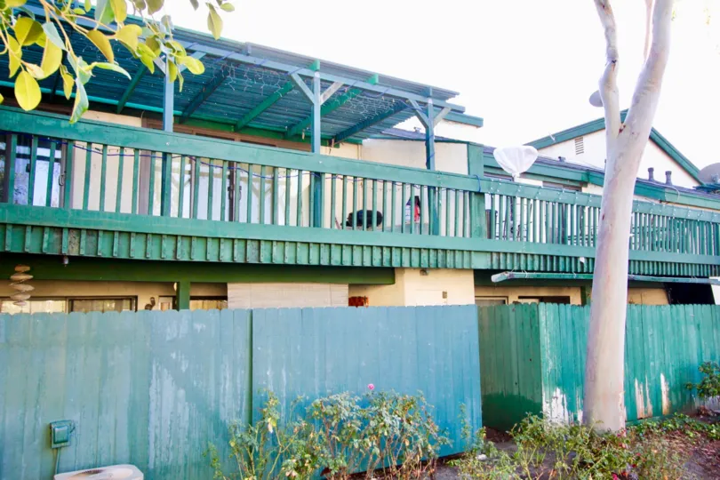 wood compound wall around buildings in Greenhouse West