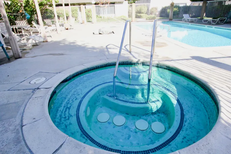 THE HOUSE IN THE HIDDEN VILLAGE WITH THE SWIMMING POOL, TABLES, PLANTS, TREES