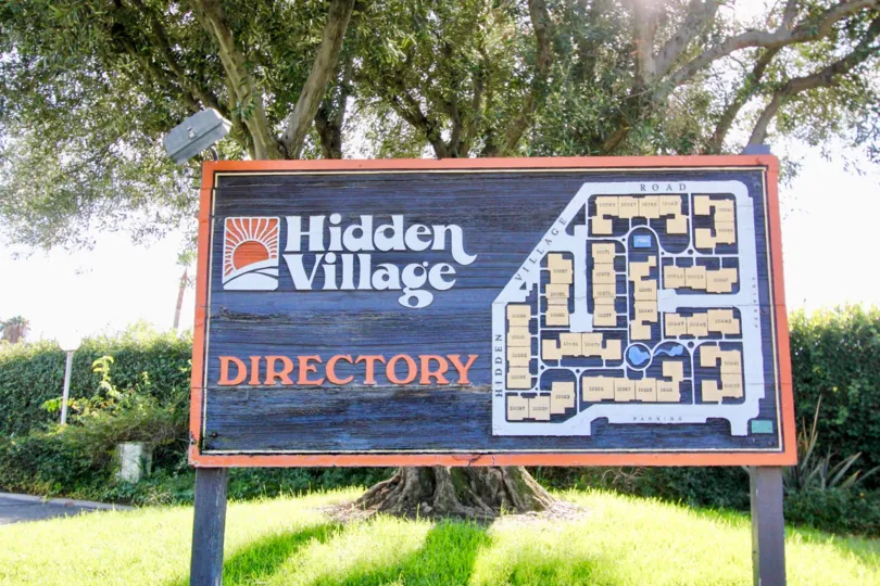 THE TREE IN THE HIDDEN VILLAGE WITH THE HIDDEN VILLAGE DIRECTORY BOARD