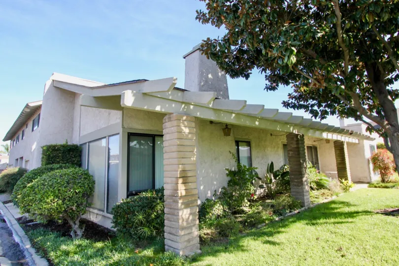 Villa having green lawn and trees nearby in Hidden Village of Garden Grove