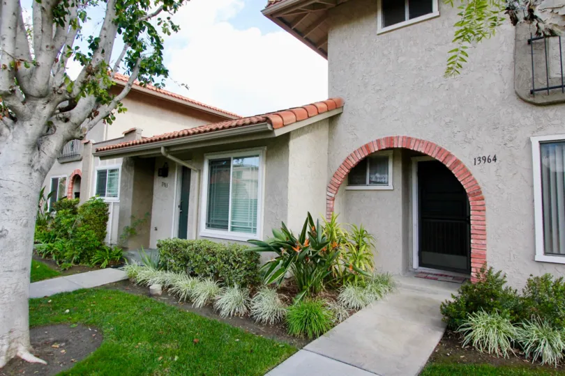 A lovely home with rounded entranceway and garden in La Jolla Plaza, Garden Grove, CA