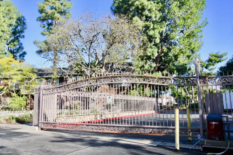 A large iron gate at the entrance of Lake Grove community