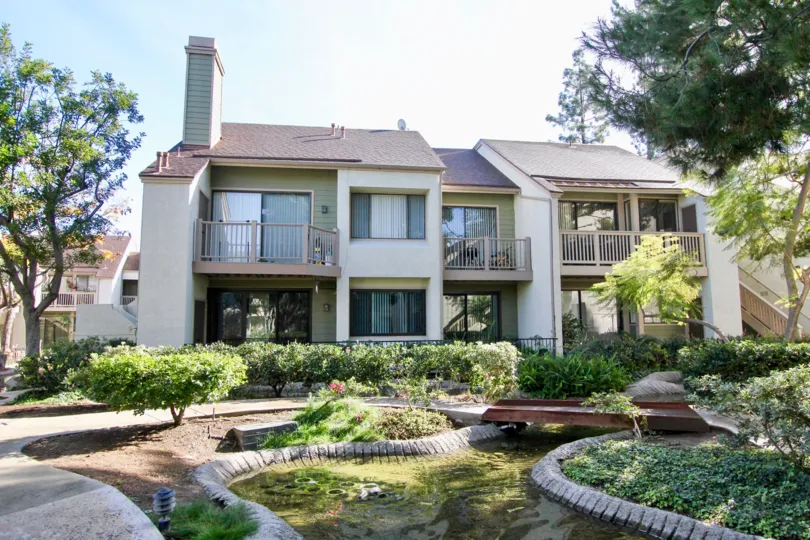 THE HOME IN THE LAKESIDE WITH THE PATHWAY, PLANTS, TREES
