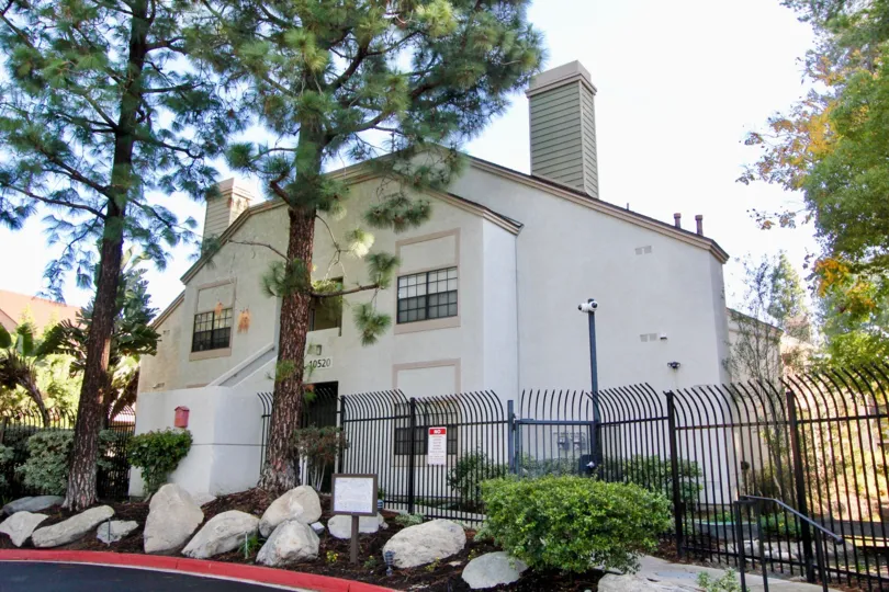 The white color building of Lakeside with large trees in front