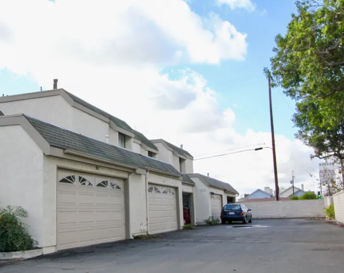 THE HOUSE IN THE LIVINGSTON MEADOWS WITH THE CAR PARKING, SHUTTERS, TREES