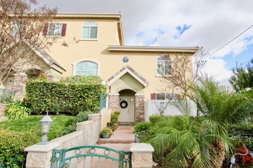 A multistory, luxuriously styled home with a vibrant exterior located in the Lorna Villa area of Garden Grove, California.