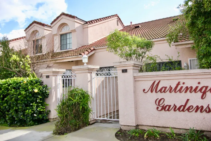 THE HOUSE IN THE MARTINIQUE GARDENS WITH THE NAME WALL, PLANTS, TREES
