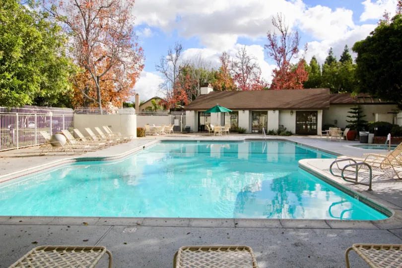 A large pool and lounge area on a sunny day, locatedd in Meadow Brook Vllage, in Garden Grove, California.