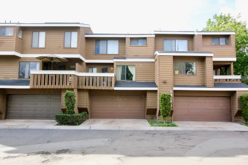 Enjoy a balcony, private garage, and 2 floors of living at Meadow Brook Village in Garden Grove, CA