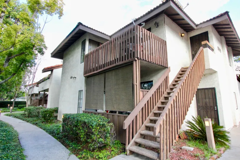 Home with staircase and balcony at Meadow Brook Village in Garden Grove CA