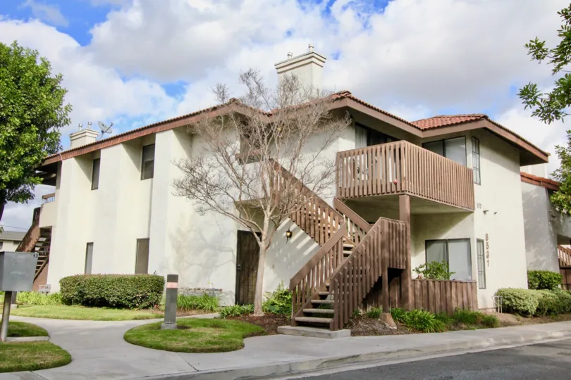 House at the Meadow Brook Village in Garden Grove with little trees and road