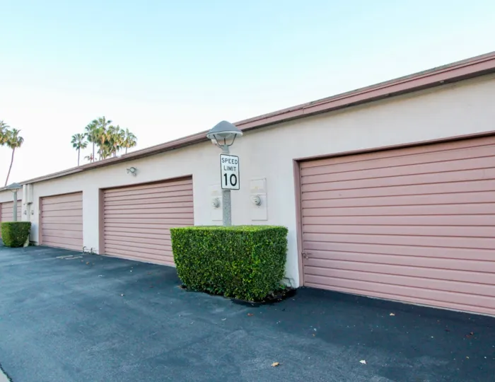 Building at the Montecito Plaza in Garden Grove with bushes and road