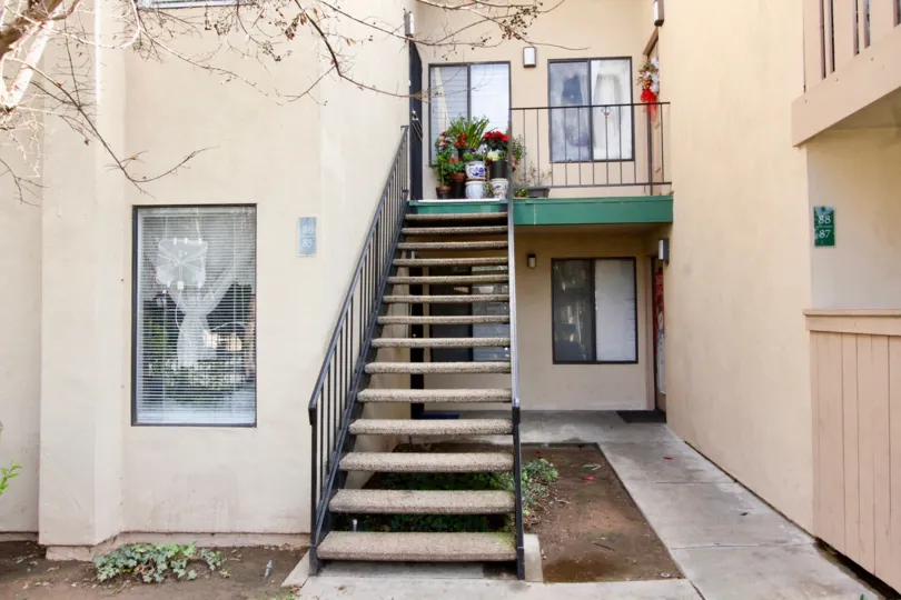 stair in front of the pink color painted house in Park Glenwood