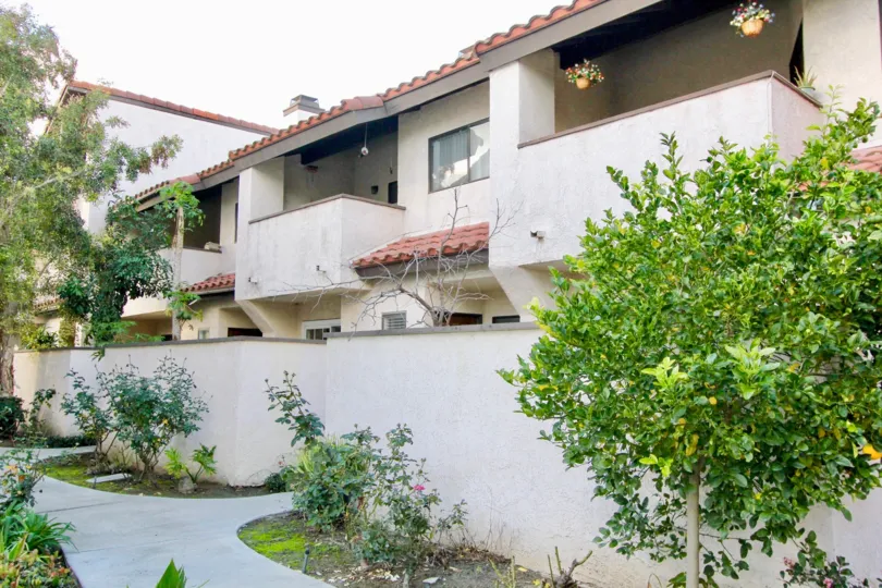 The Peppertree Townhomes provide privacy with walls and trees in Garden Grove California