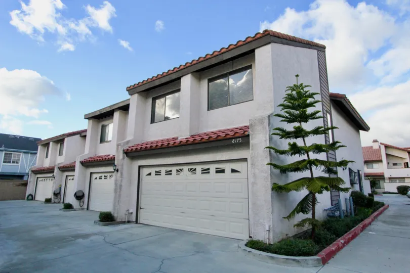 THE 8175 APARTMENT IN THE PEPPERTREE TOWNHOMES WITH THE PLANTS, SHUTTERS
