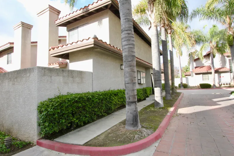 Regency Terrace in Garden Grove California with great structures, tall palm trees and brick road