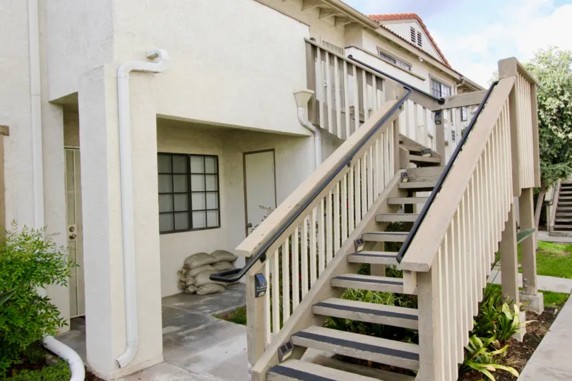 THE BUILDING IN THE SPRING GARDEN VILLAS WITH THE UPSTAIRS, GRASSLAND, TREES