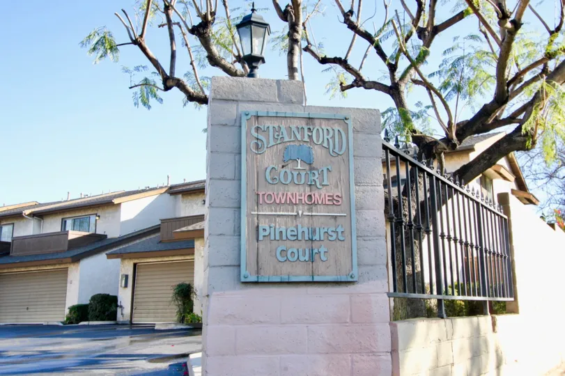 THE HOUSE IN THE STANFORD COURT WITH STANFORD COURT TOWNHOMES WALL, TREES