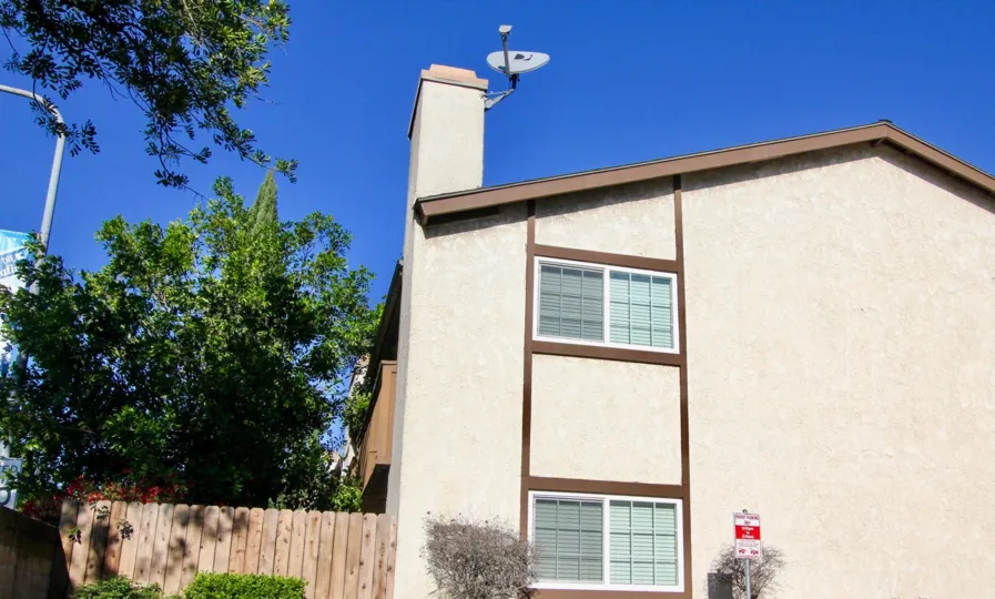 Side view of an apartment on Stanford Court in Garden Grove, CA on a sunny day.