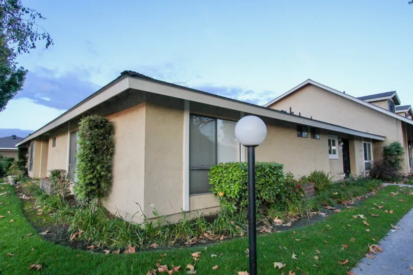 House at the Stonegate in Garden Grove with bushes