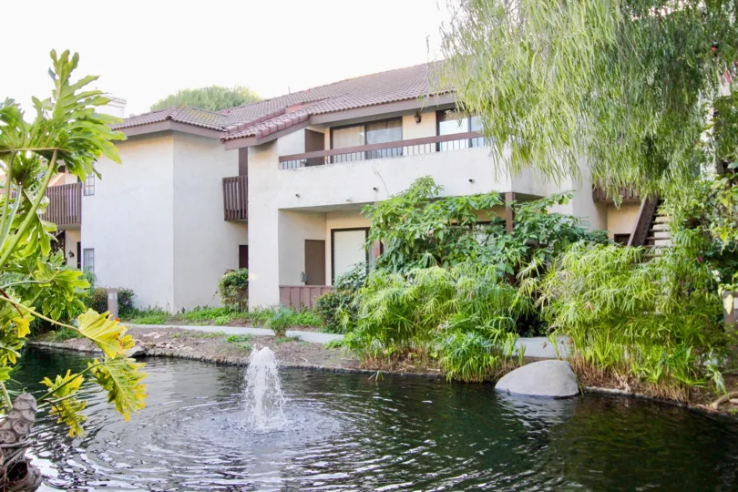 THE HOUSE IN THE VILLAS WITH THE LAKE, ROCKS, PLANTS, TREES