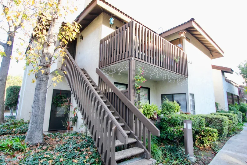 THE BUNGALOW IN THE VILLAS WITH THE UPSTAIRS, FLOWER PLANTS, TREES