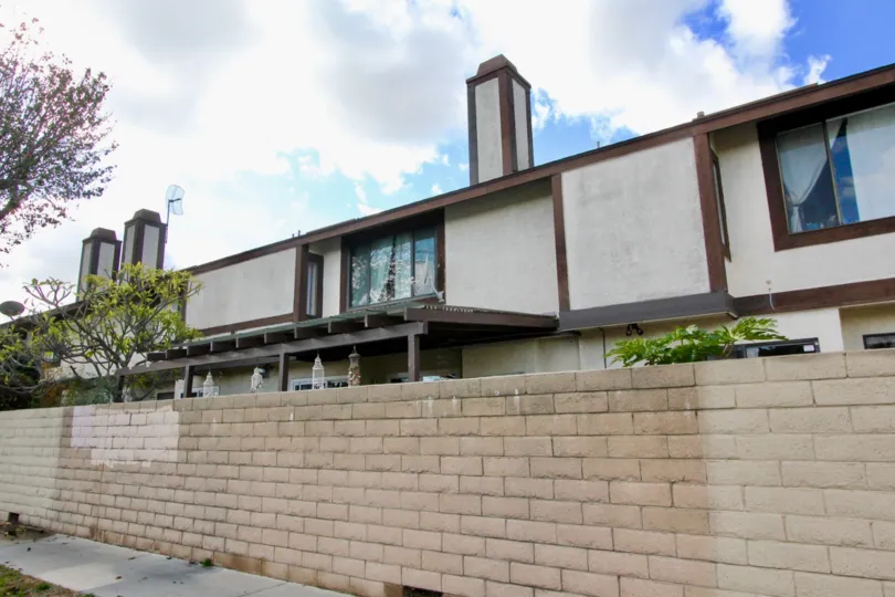 A house with big chimmes and windows at tudor estates, garden grove california