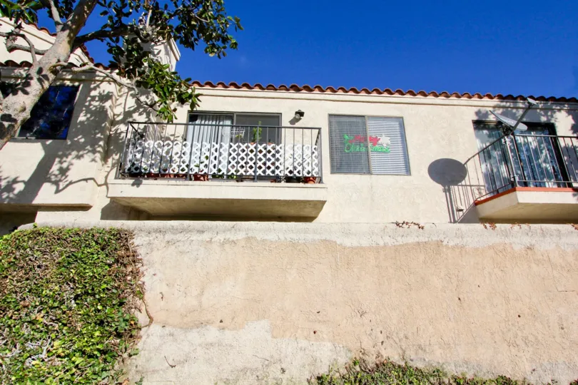THE HOUSE IN THE VILLA GRANDE WITH THE BALCONIS, TREES, PLANTS