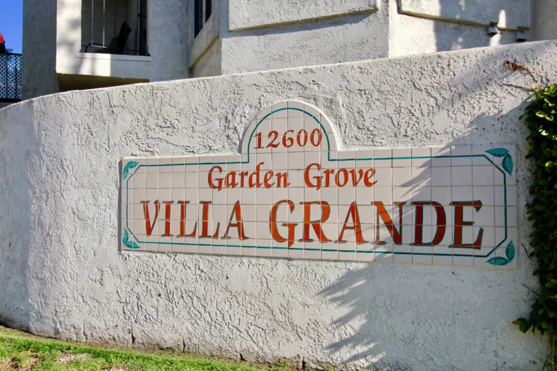 A stone signage with tiled wordings in the Villa Grande community.
