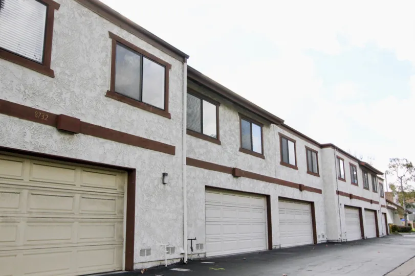A set of vintage-styled condominiums with included garages located in the Yockey Condominiums community in Garden Grove, California.
