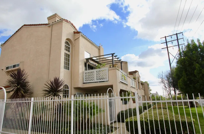 Yorkshire Townhomes Building with green Park at Garden Grove