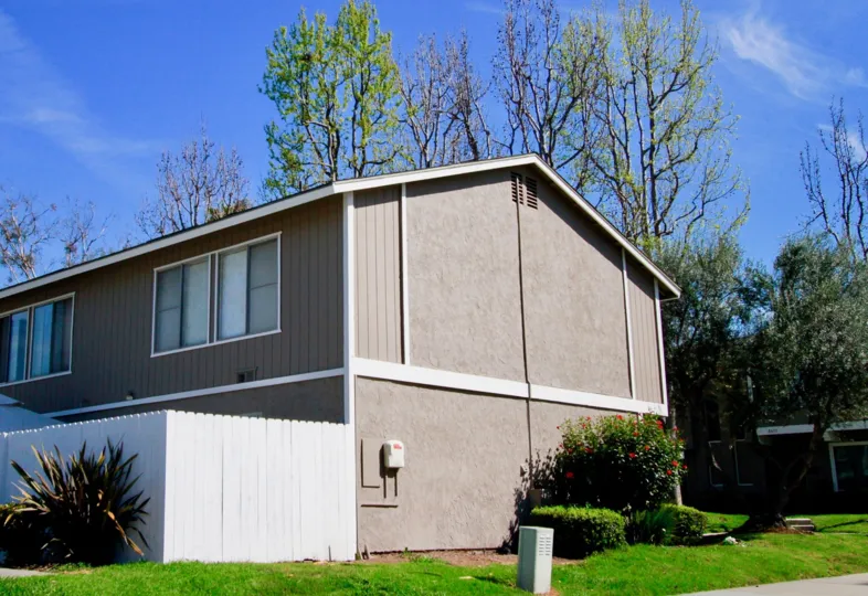 A bi level residential home with trees surround in Bayshores community.