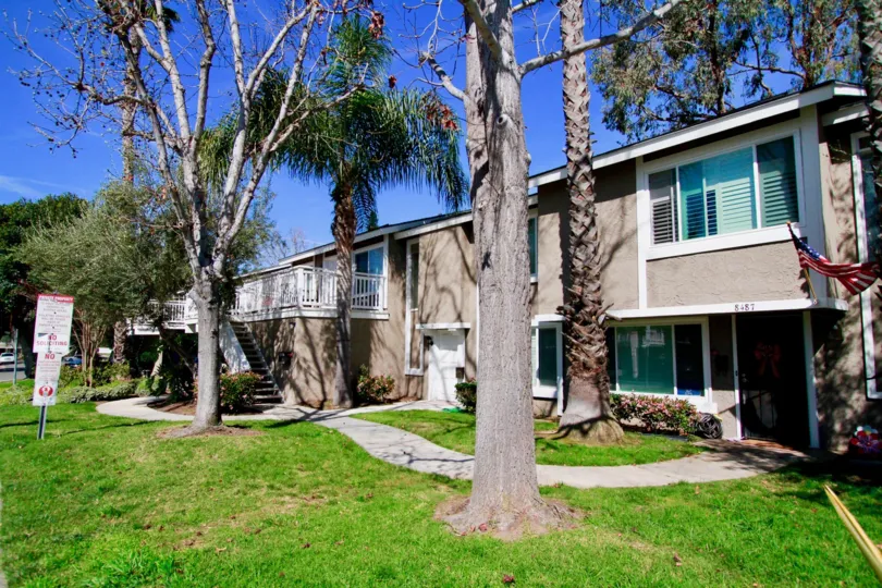 A winding sidewalk criss-crosses through trees at Bayshores in Huntington CA