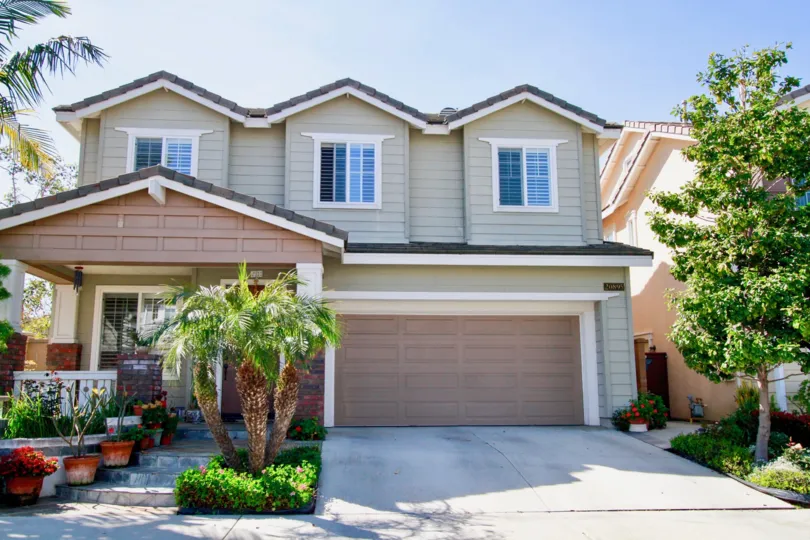 Home in Beachside Community in Huntington Beach Almond and Brown with two car garage