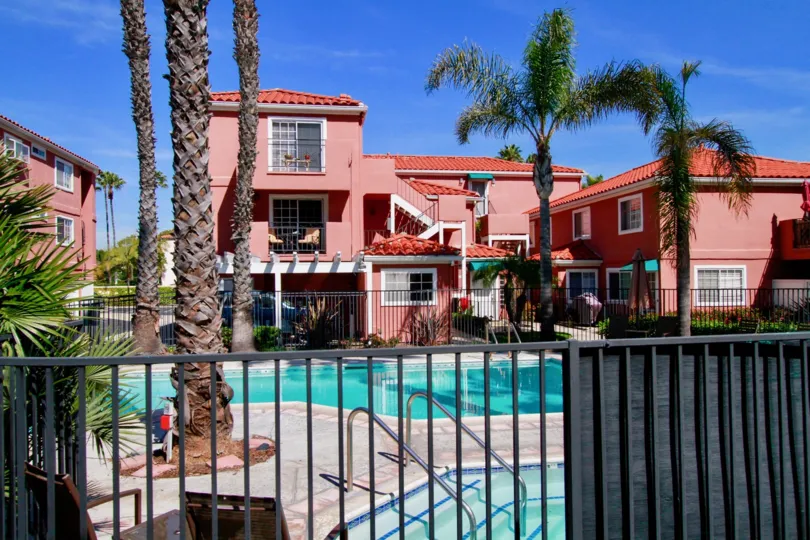 The blue sky against the red buildings of the Brisas Del Mar community